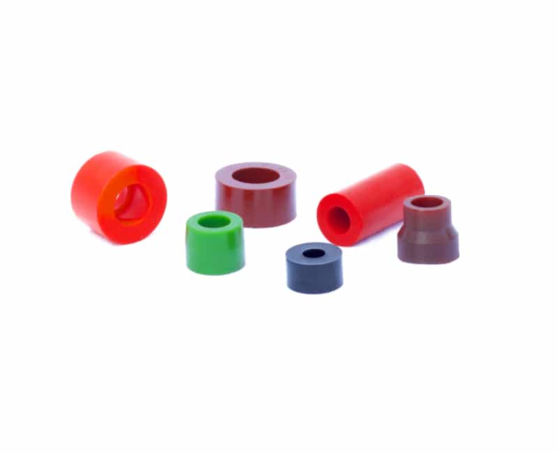 Multiple custom molded polyurethane bushings used throughout the automotive industry.