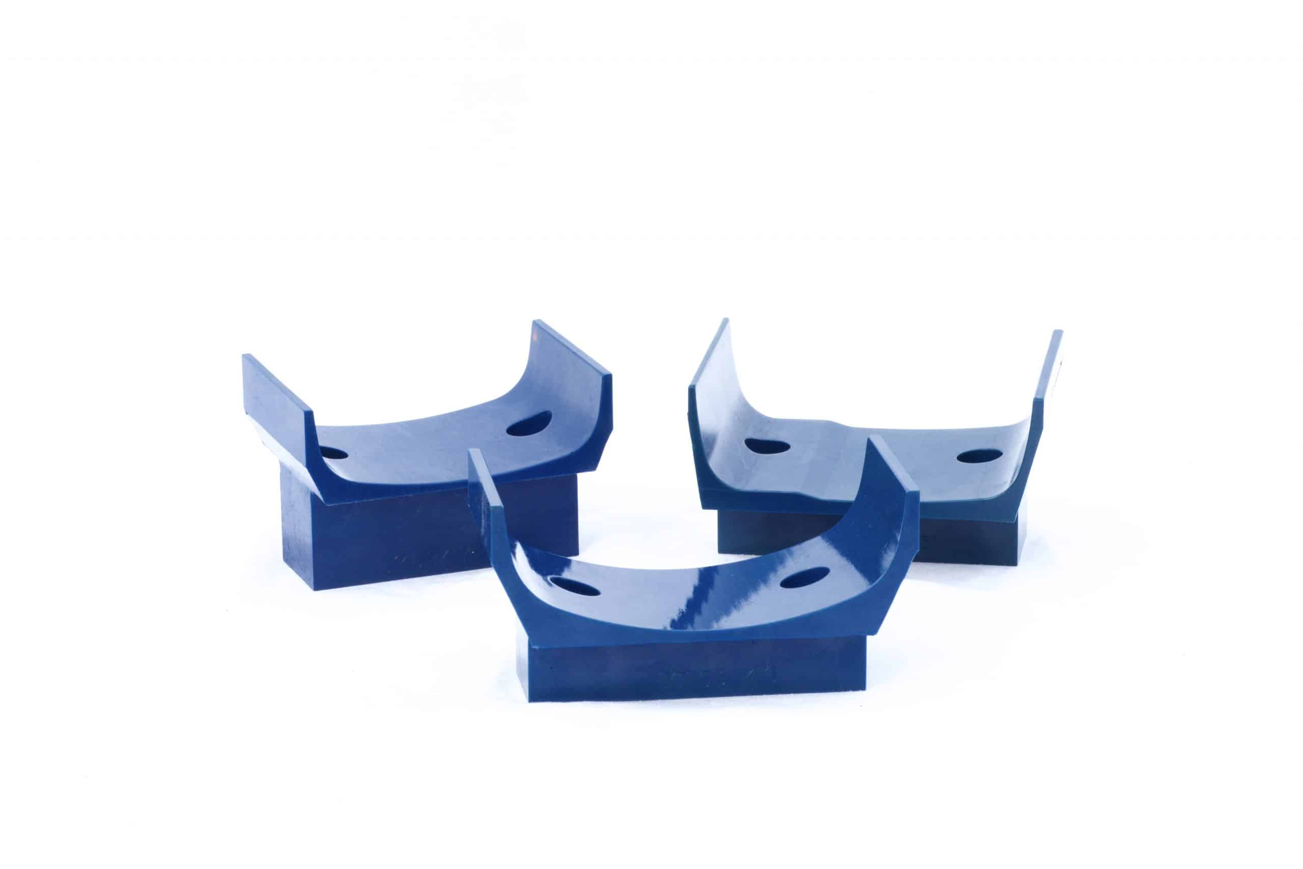 Three polyurethane V-buckets used in blow molding operations.