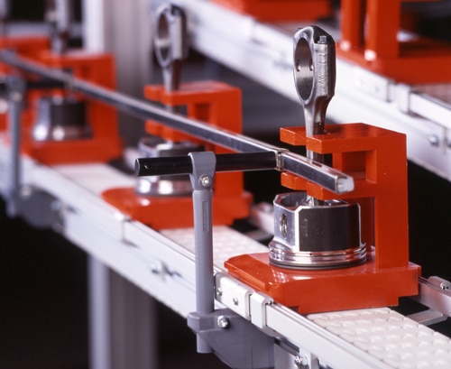 Polyurethane pallets moving pistons through automobile assembly operations. 