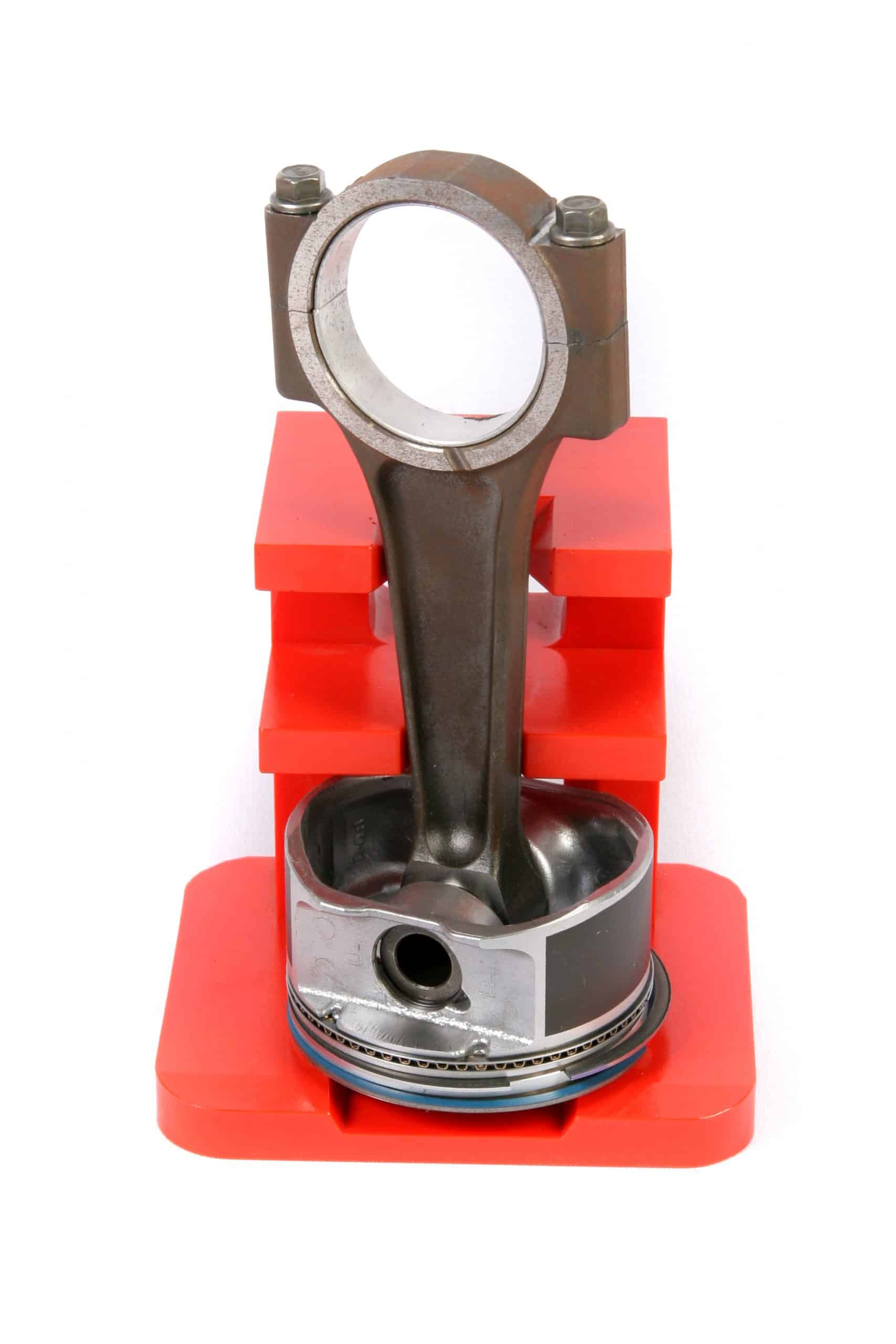 Polyurethane transport fixture for mustang piston assembly.
