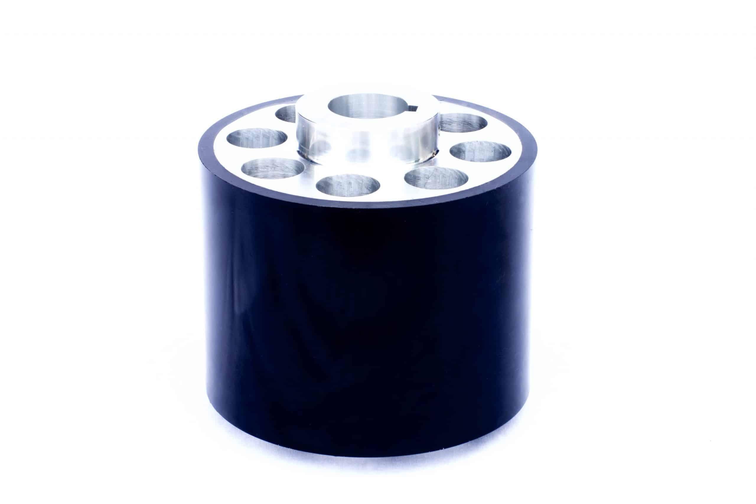 Large black 70A polyurethane roller with aluminum insert.