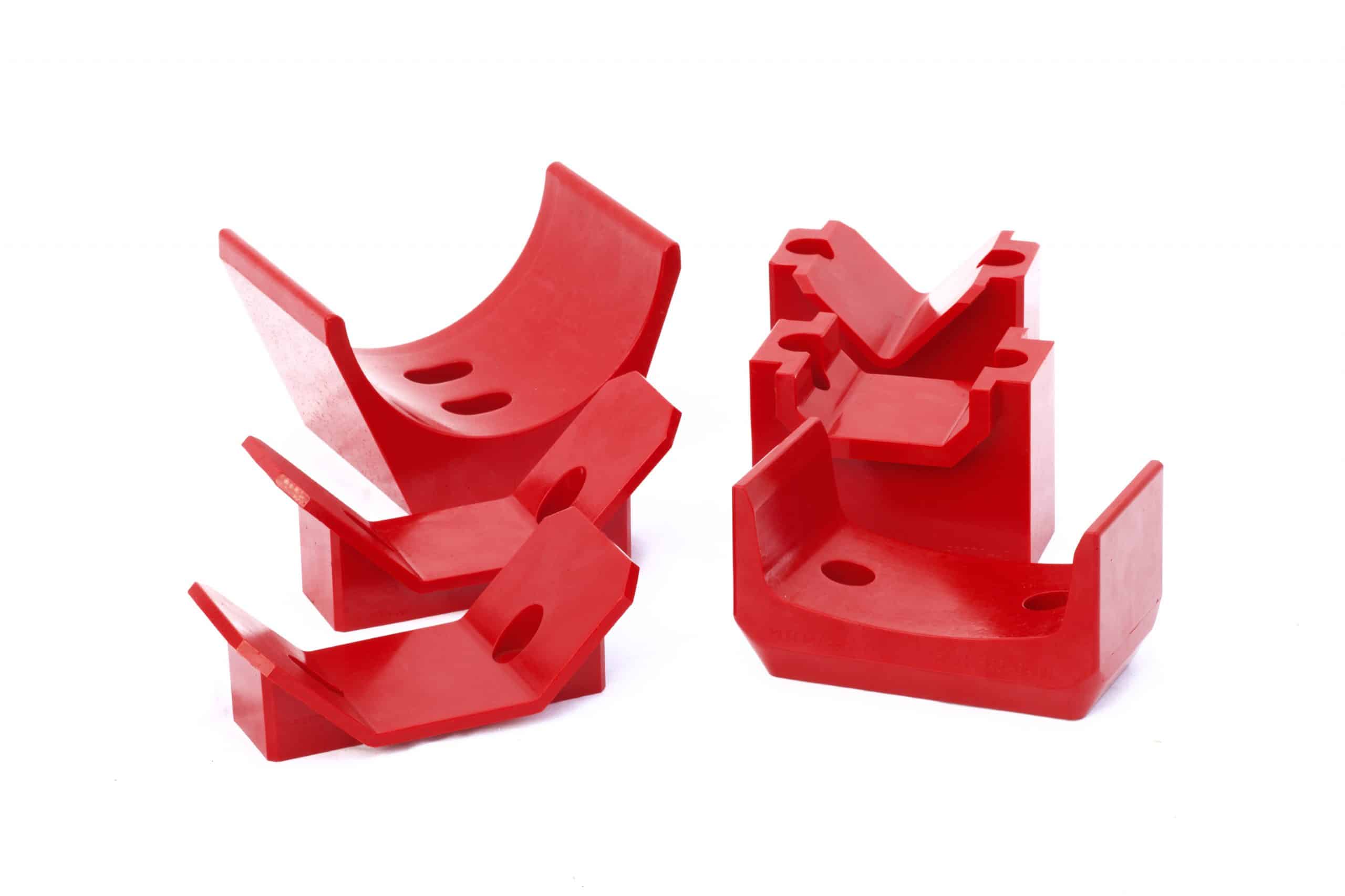 Array of red urethane V-buckets.